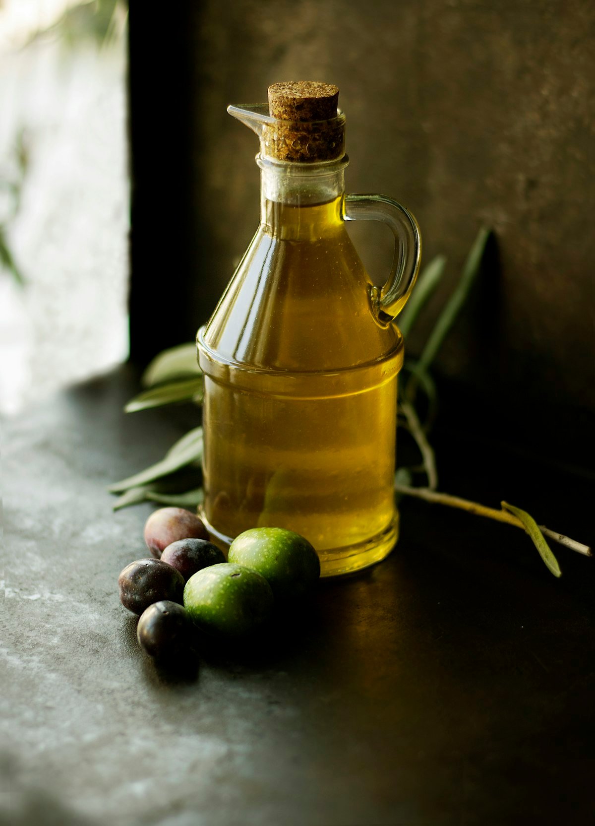 Glass cruet of golden extra virgin olive oil